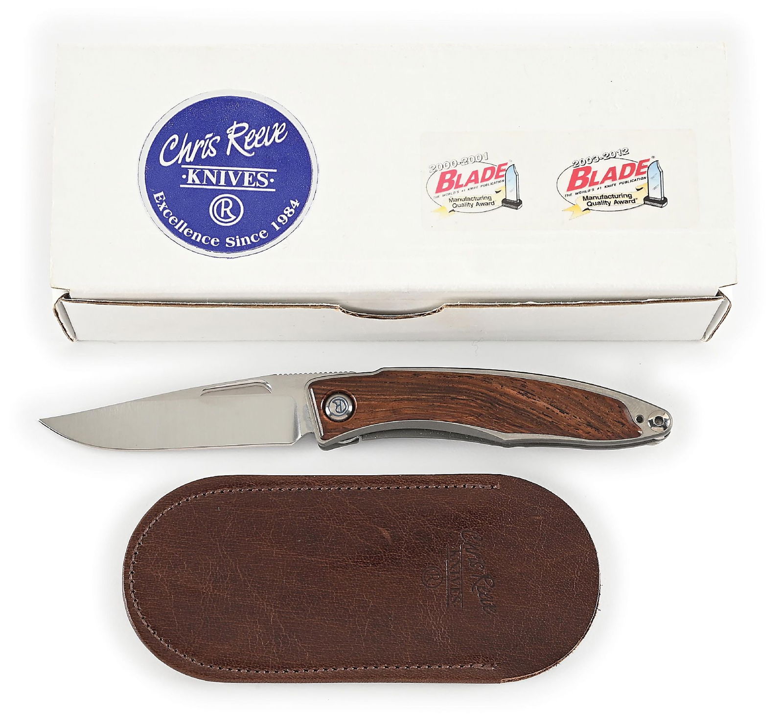 BOXED CHRIS REEVE MNANDI.: Features a satin finished S35VN blade with nail nick assists and knurled thumb rest. Titanium frame with Honduran rosewood inlays. The knife operates using a liner lock mechanism that functions