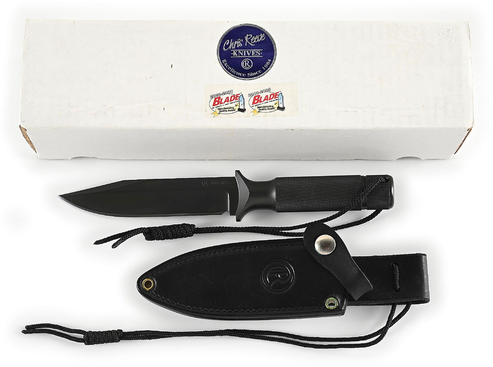 BOXED CHRIS REEVE MARK VI.: Features a dark A2 clip point blade marked "CR MADE IN USA" on obverse cheek. Hidden tang construction with knurled hollow handle that features removable pommel and wrist thong. Complete with its