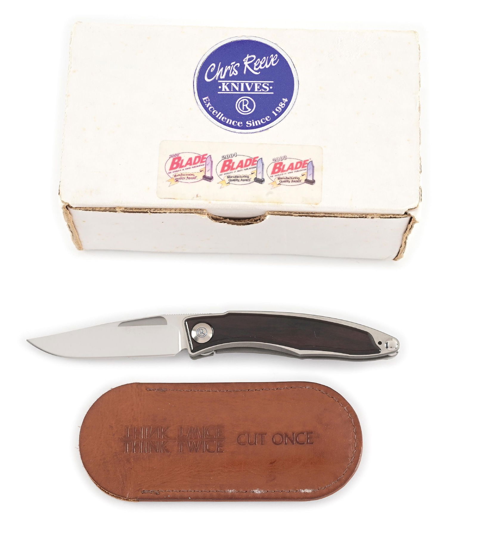 BOXED CHRIS REEVE MNANDI.: Features a satin finished S30V blade with nail nick assists and knurled thumb rest. Titanium frame with African Blackwood inlays. The knife operates using a liner lock mechanism that functions