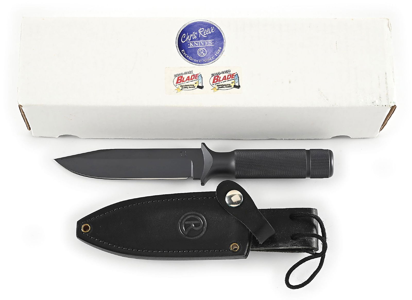 BOXED CHRIS REEVE MK VI.: Features a dark A2 clip point blade marked "CR" on obverse cheek and "MADE IN USA" on reverse cheek. Hidden tang construction with knurled hollow A2 handle that features removable pommel and lanyard
