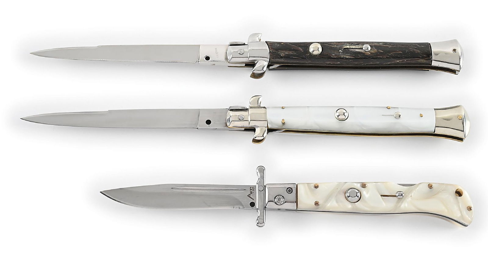LOT OF 3: C. 1950S-60S CURRENT ITALIAN STILETTO SWITCHBLADE KNIVES.: Lot consists of: (A) C. 1950s. Swivel bolster. Appears lightly used and sharpened. Blade tang is stamped “Rostfrei” in script. Works fine. Locks open firmly. Blade tip seats below handle w