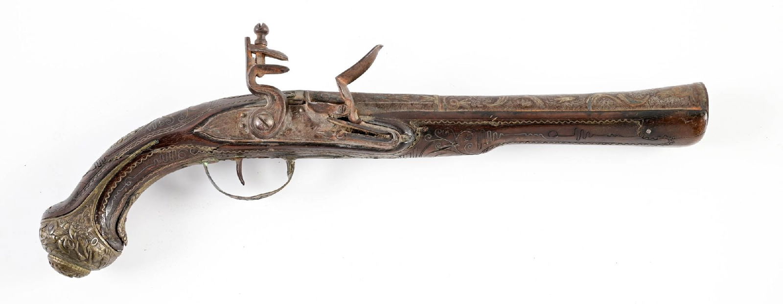 (A) MIDDLE EASTERN FLINTLOCK PISTOL.: With a wide mouth indicating potential use as a dag, but of a more conventional form. Stock inlaid with brass and silver wire throughout, bass furniture with floral designs throughout, with wrist,
