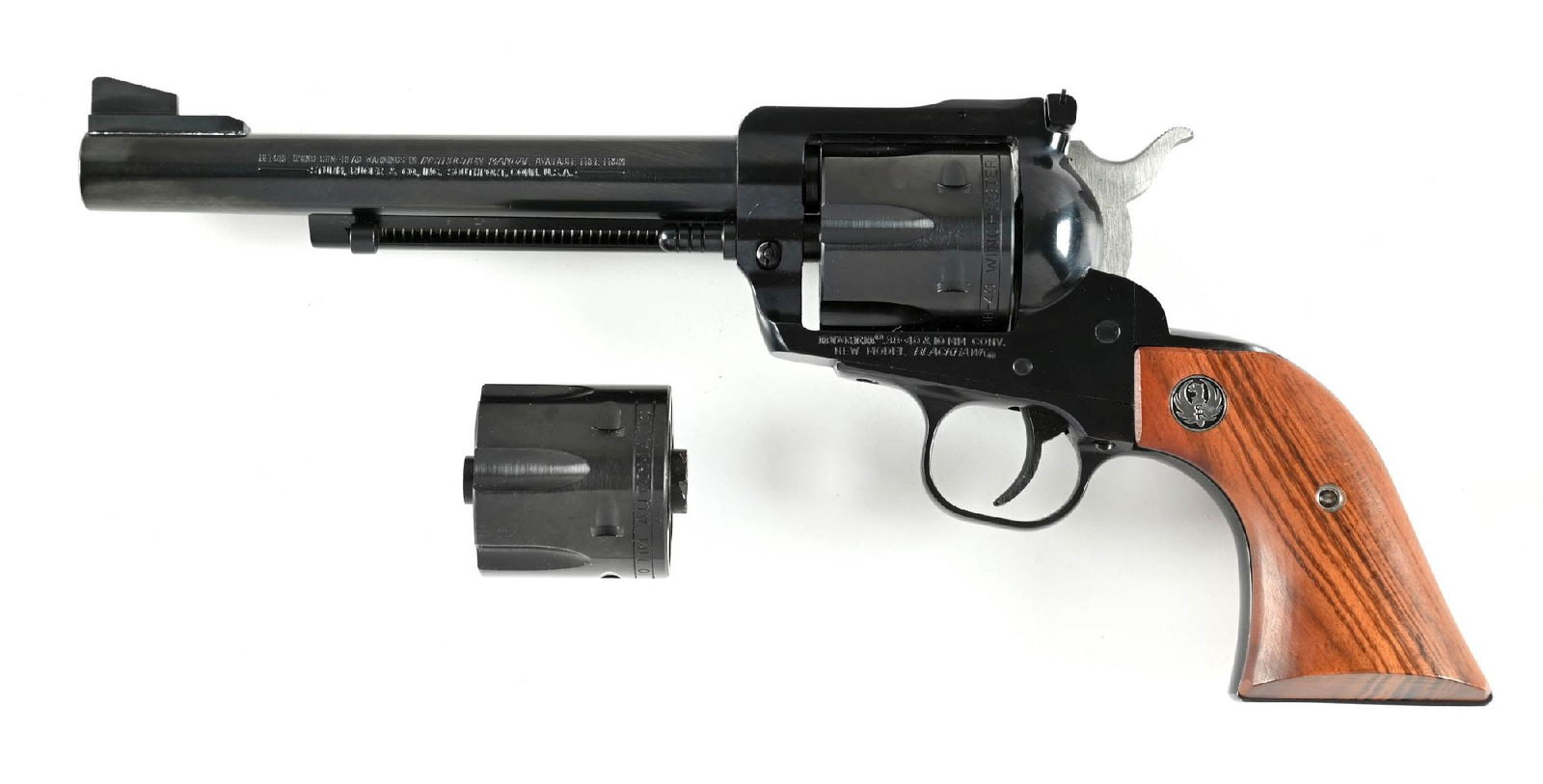(M) RUGER NEW MODEL BLACKHAWK CONVERTABLE SINGLE ACTION REVOLVER.: This standard revolver is fit with a .38-40 cylinder and is accompanied by an additional 10mm cylinder. Finish is standard blue and features the adjustable rear sight with walnut grips with Ruger meda