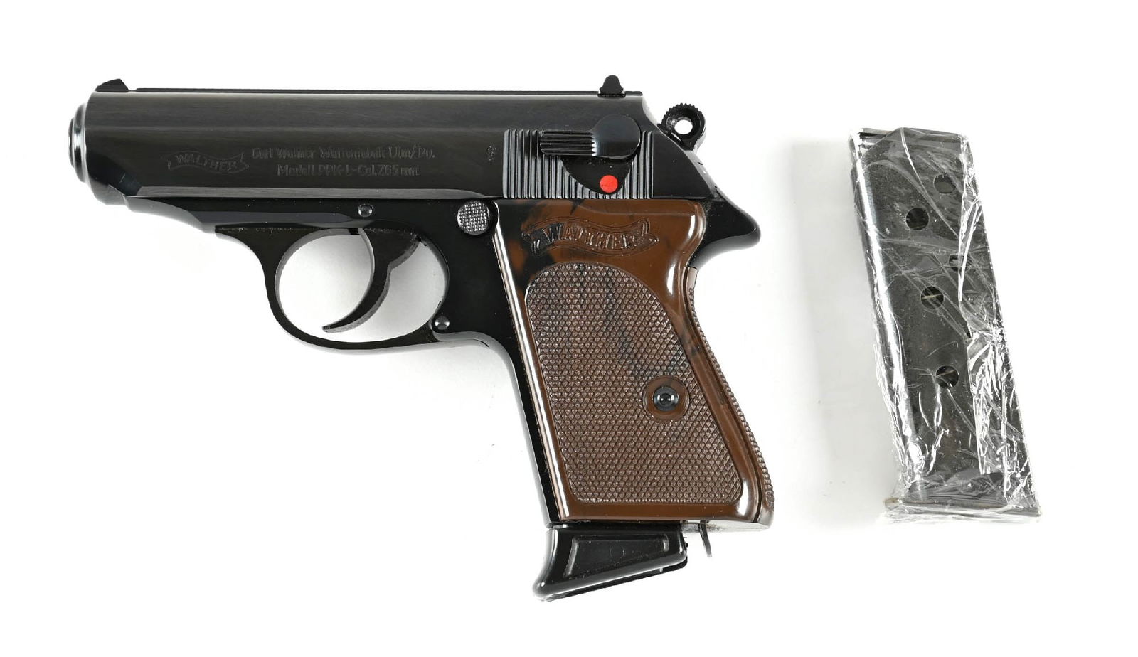(M) WEST GERMAN MARKED WALTHER PPK-L SEMI-AUTOMATIC PISTOL.: Manufactured by Walther in West Germany in 1964. With 2 magazines: one flat base and one with finger extension. Brown plastic wrap grips. Lightweight alloy frame. CONDITION: Like new in its original b