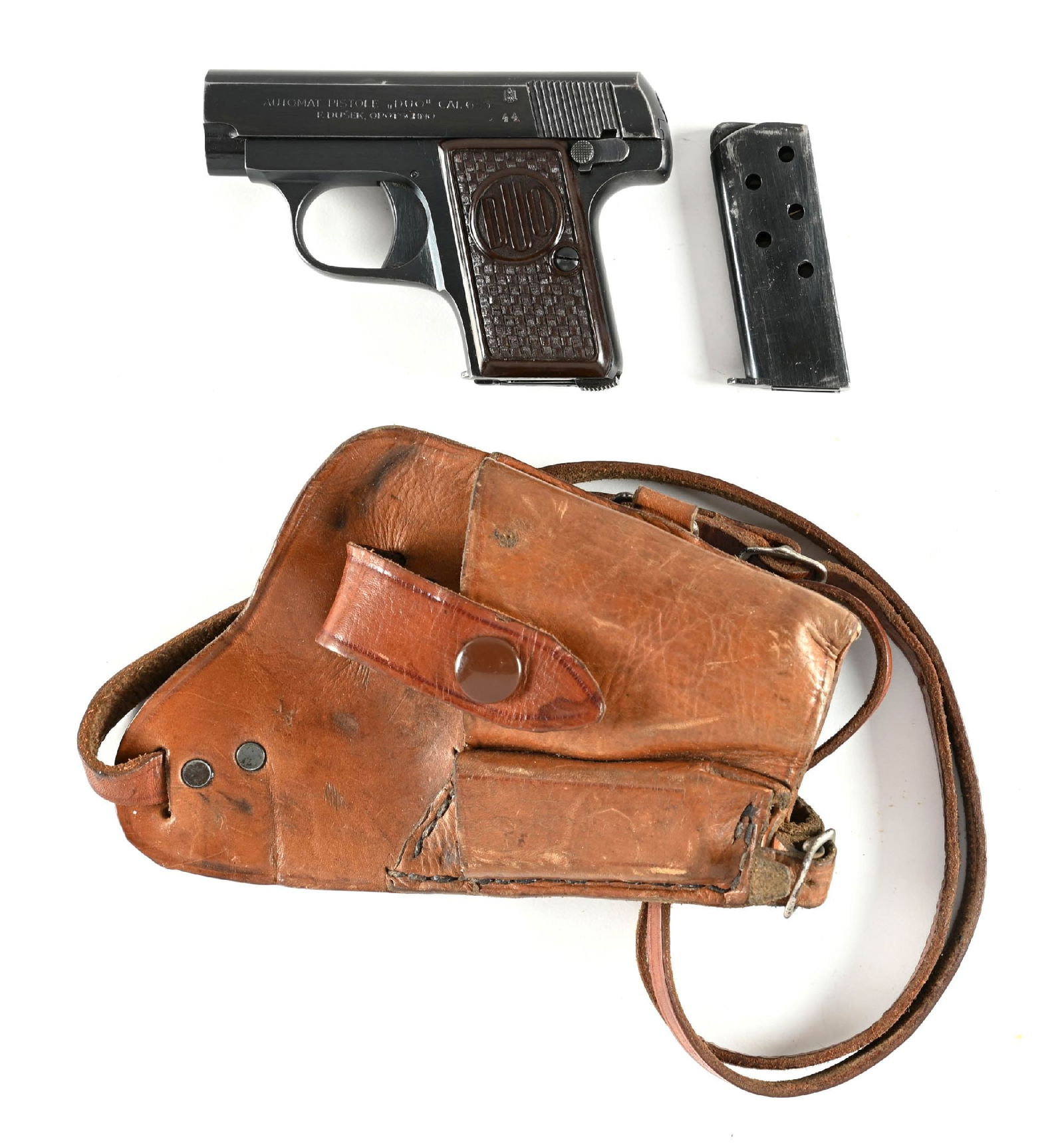(C) CZECH CZ DUO SEMI AUTOMTIC POCKET PISTOL (1944).: 1944 date code on left side of slide. Finish is still a nice commercial quality and sports the brown composition grips. Comes in a period shoulder holster with an extra magazine. CONDITION: Excellent.