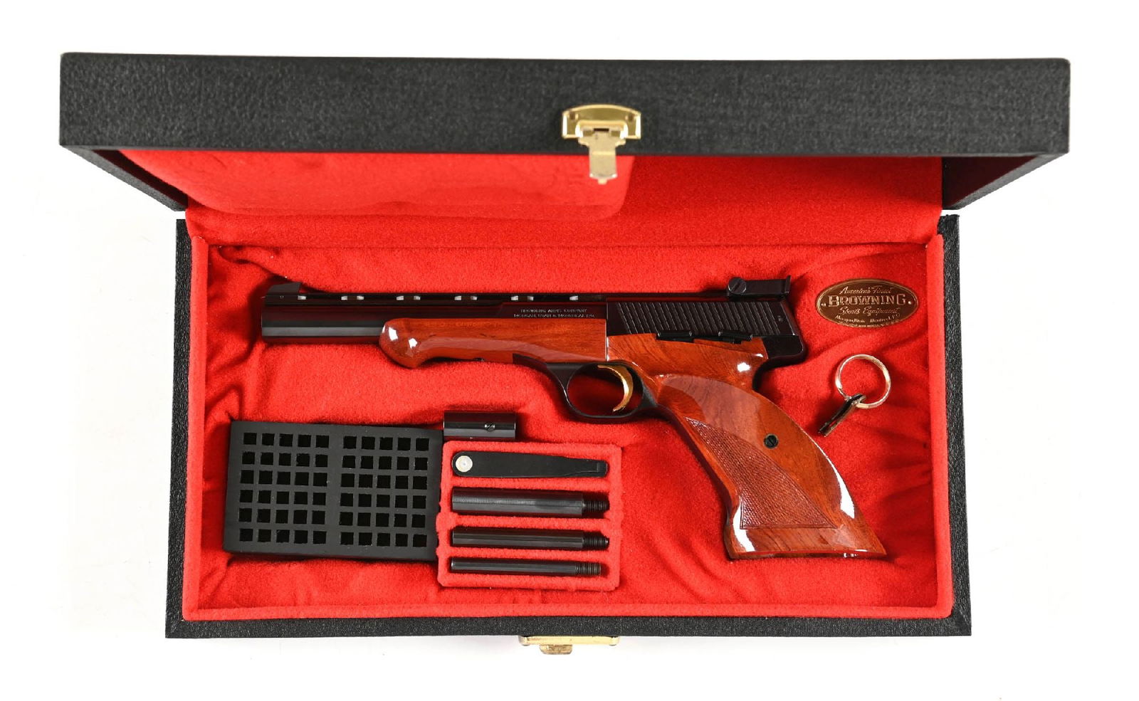 (C) CASED BELGIUM BROWNING MEADALIST SEMI-AUTOMATIC .22 TARGET PISTOL.: Finished in high polish blue, a full vent rib, an adjustable target rear sight, gold-washed trigger, checkered walnut grips, and small matching forearm. Comes in its original black leatherette case wi