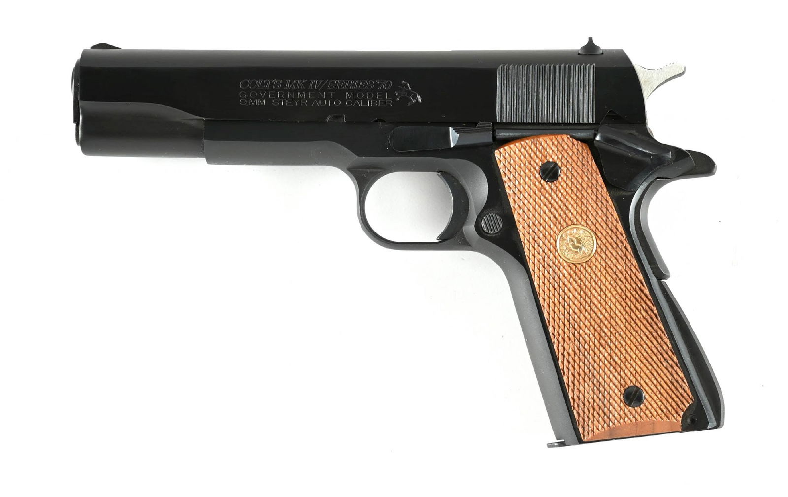 (M) COLT MARK IV SERIES 70 GOVERMENT MODEL 1911 9MM STEYR SEMI AUTOMATIC PISTOL WITH BOX.: Production of this caliber was extremely limited, predominantly intended for foreign sales and not generally mass marketed. Standard dual tone blue finish, wind drift rear sight, checkered walnut grip