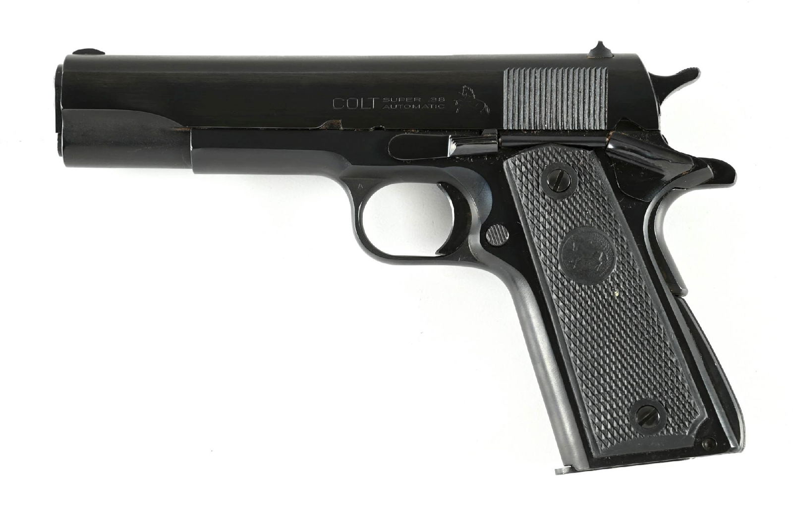 (C) COLT SUPER 38 .38 SUPER SEMI AUTOMATIC PISTOL (1952).: Dates to 1952. Nicely restored with modern replacement grips. The hammer is checkered while slide stop and safety are serrated. Finish is blue. The blued .38 Super magazine is stamped at base. CONDITI