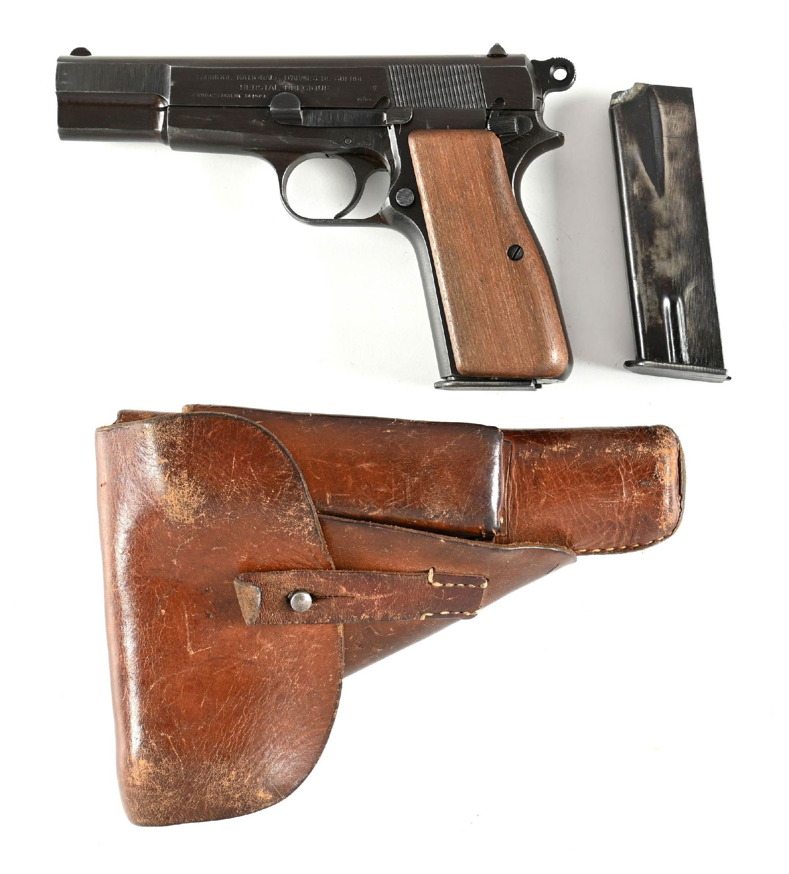 (C) WWII GERMAN INSPECTED BROWNING HI-POWER SEMI-AUTOMATIC PISTOL.: This is an early war waffenamt "WaA 140" inspected pistol. Finished in the war time blue and features the standard wind drift rear sight with smooth walnut grips and comes in a period holster with an