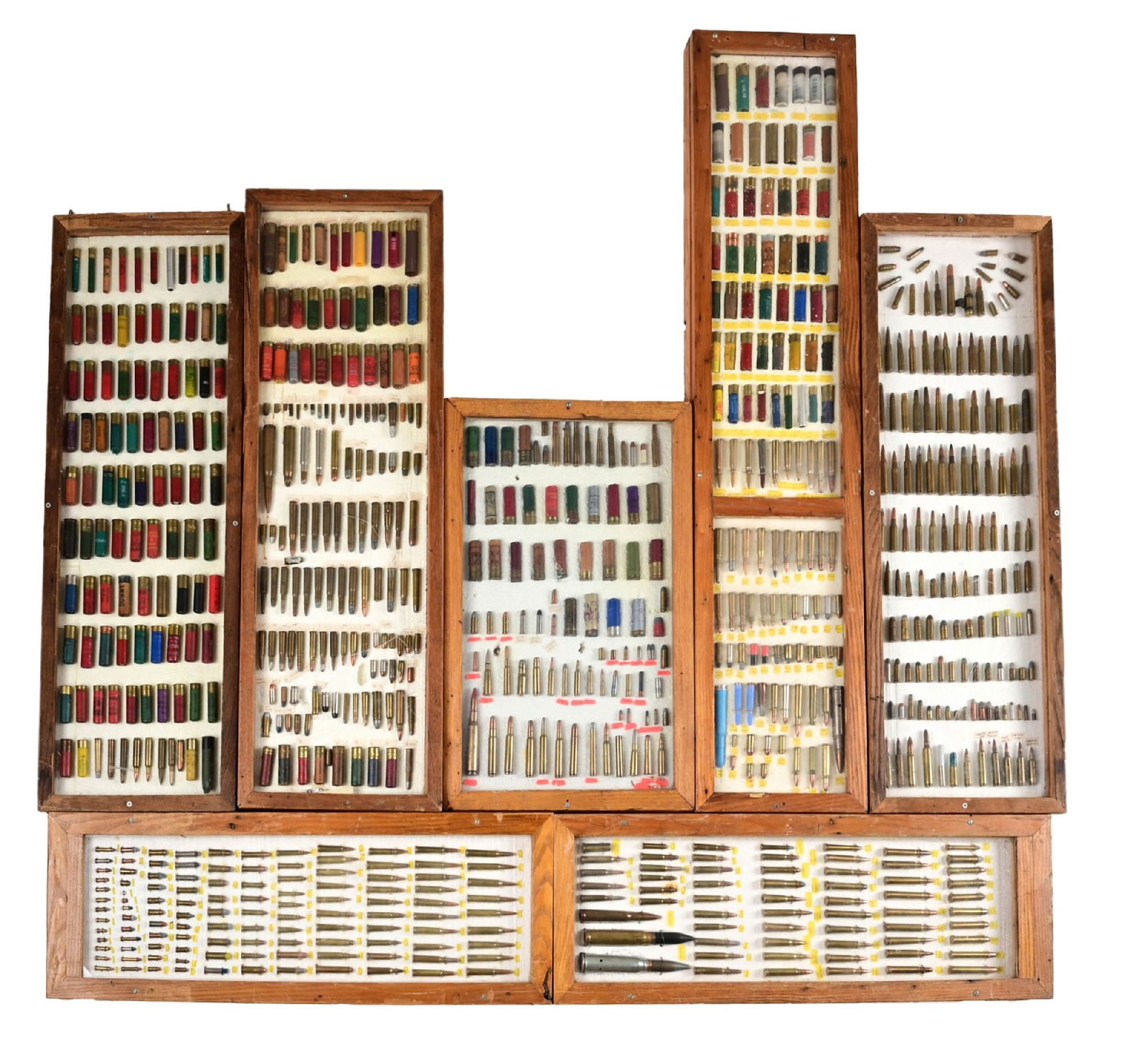 LOT OF 6 RUSTIC BULLET BOARDS: Lot consists of six rustic bullet boards with calibers ranging from .22 blanks up to .458 Magnum. Bullets are affixed to styrofoam backing and housed in wood cases. CONDITION: Good, with evidence of