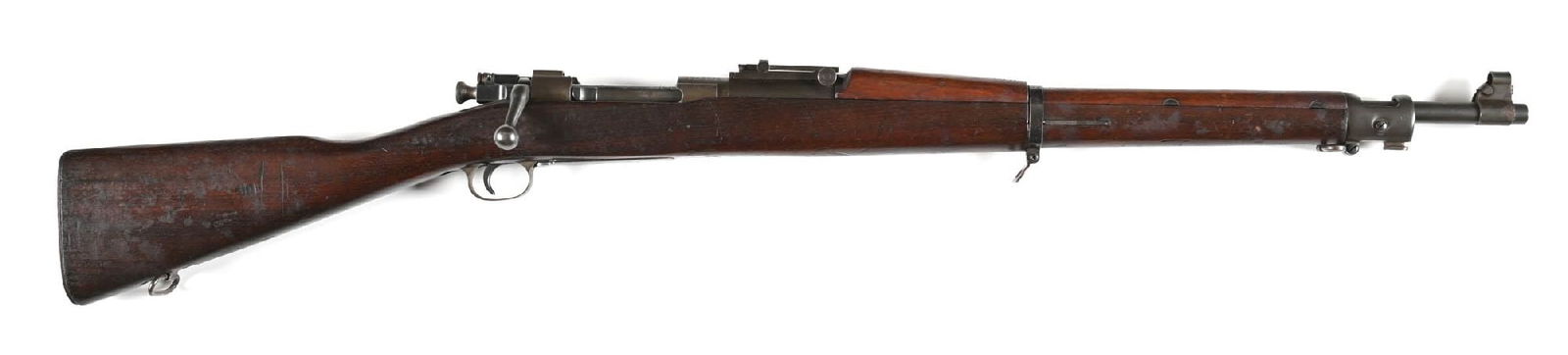 (C) WORLD WAR II U.S. REMINGTON MODEL 1903 BOLT ACTION RIFLE.: The barrel is stamped RA and dated 12-42, Standard issue with some mixed pressed steel parts, the rear bridge has the A3 rear sight cut but sports the barrel mounted 2700 yard sight, walnut stock with