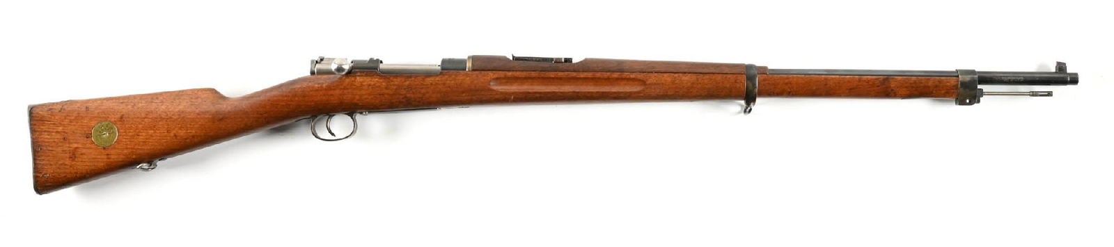 (C) SWEDISH CARL GUSTAFS M96 MAUSER BOLT ACTION RIFLE.: Manufactured in 1917. Arsenal blued finish with strawed small parts and an in-the white bolt. Blade front sight and ladder rear. Reoilded military wood stocks. Externally visible numbers matching. Imp