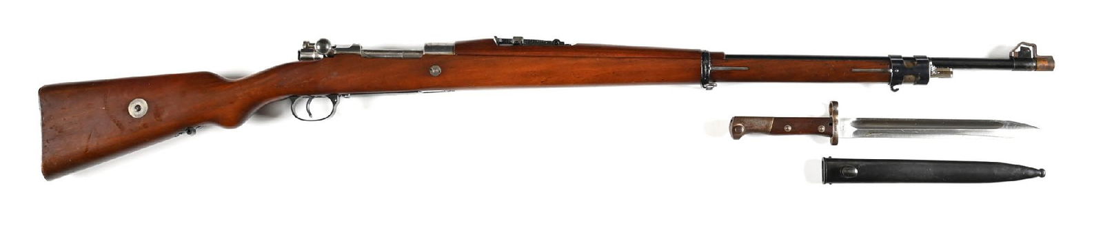 (C) STEYR M1912 CHILENO BOLT ACTION RIFLE SERIAL NUMBER A95 WITH BAYONET.: Classic military configuration with high polish blued finish, barleycorn front sight, tangent rear, in-the-white receiver with Chilean crest, and walnut stocks. Externally visible numbers match. Inclu