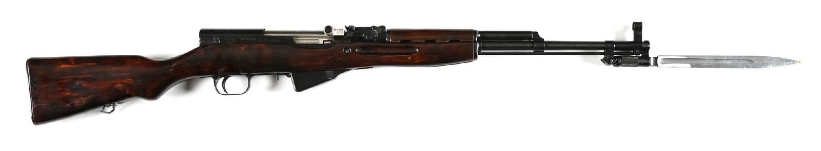 (C) RUSSIAN TULA SKS 7.62X39MM SEMI-AUTOMATIC RIFLE: Manufactured in 1954. Arsenal blued finish, the bolt remaining in-the-white. Hooded post front sight and tangent rear. Barrel retaining folding blade bayonet. Rich red lacquered birch stocks with stan