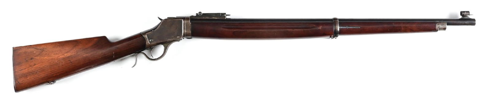 (C) WINCHESTER MODEL 1885 SINGLE SHOT WINDER MUSKET (1912): Dates to 1912. These special rifles were built on the 1885 action in the military fashion, featuring the full length forearm with finger groove, walnut stock with smooth steel buttplate, swivels, a gl