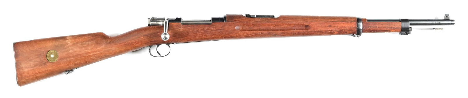(C) HUSQVARNA SWEDISH M38 MAUSER BOLT ACTION RIFLE.: Manufactured 1942. Blue finished with turned down bolt handle. These became the mainstay of the Swedish WWII arsenal. CONDITION: Exceptionally fine with all matching serial numbers. Brilliant bright b