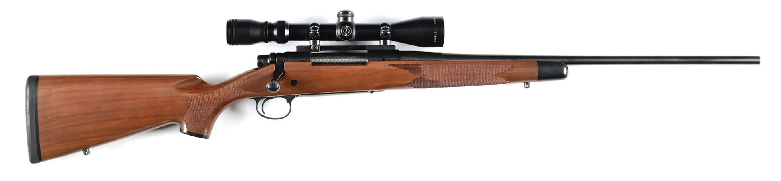 (M) REMINGTON 700 BDL BOLT ACTION RIFLE IN 7MM MAUSER.: Features the hand checkered oil finished walnut stock, pistol grip with cap, black forearm tip, straight comb, roll over cheek piece, solid black pad, jeweled bolt, and blue finish. Rifle sports a Sim