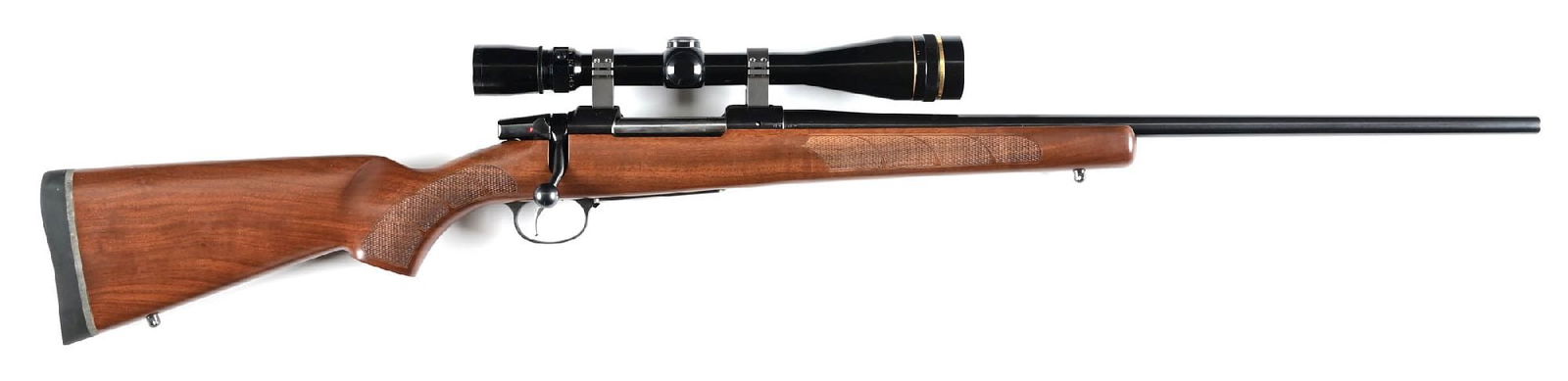 (M) CZ 550 AMERICAN BOLT ACTION RIFLE IN 7MM MAUSER WITH BOX: Blue finish, no factory barrel sights, a checkered walnut stock with pistol grip, straight comb, roll over cheek piece, solid black recoil pad, and sling eyes. Rifle sports a Leupold 6.5 x 20 Vari X 3