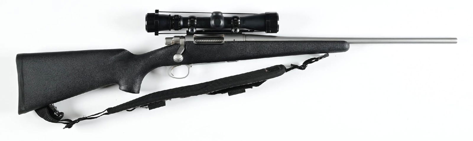 (M) REMINGTON MODEL 7 BOLT ACTION RIFLE IN .308 WINCHESTER.: Features the brushed stainless finish, jeweled bolt, black composite stock with pistol grip, straight comb, and sling. Sports a Leupold Vari X 3, 2.5 x 8 with a duplex reticle scope. CONDITION: Excell