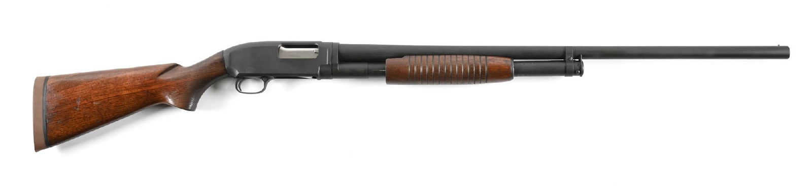 (C) WINCHESTER MODEL 12 HEAVY DUCK SLIDE ACTION 12 GAUGE SHOTGUN.: Dates to 1954. The Heavy Duck features Super Speed Super X 3" magnum chambering and is so marked on the barrel. The barrel features a single bead front sight, take down, a plain walnut stock with