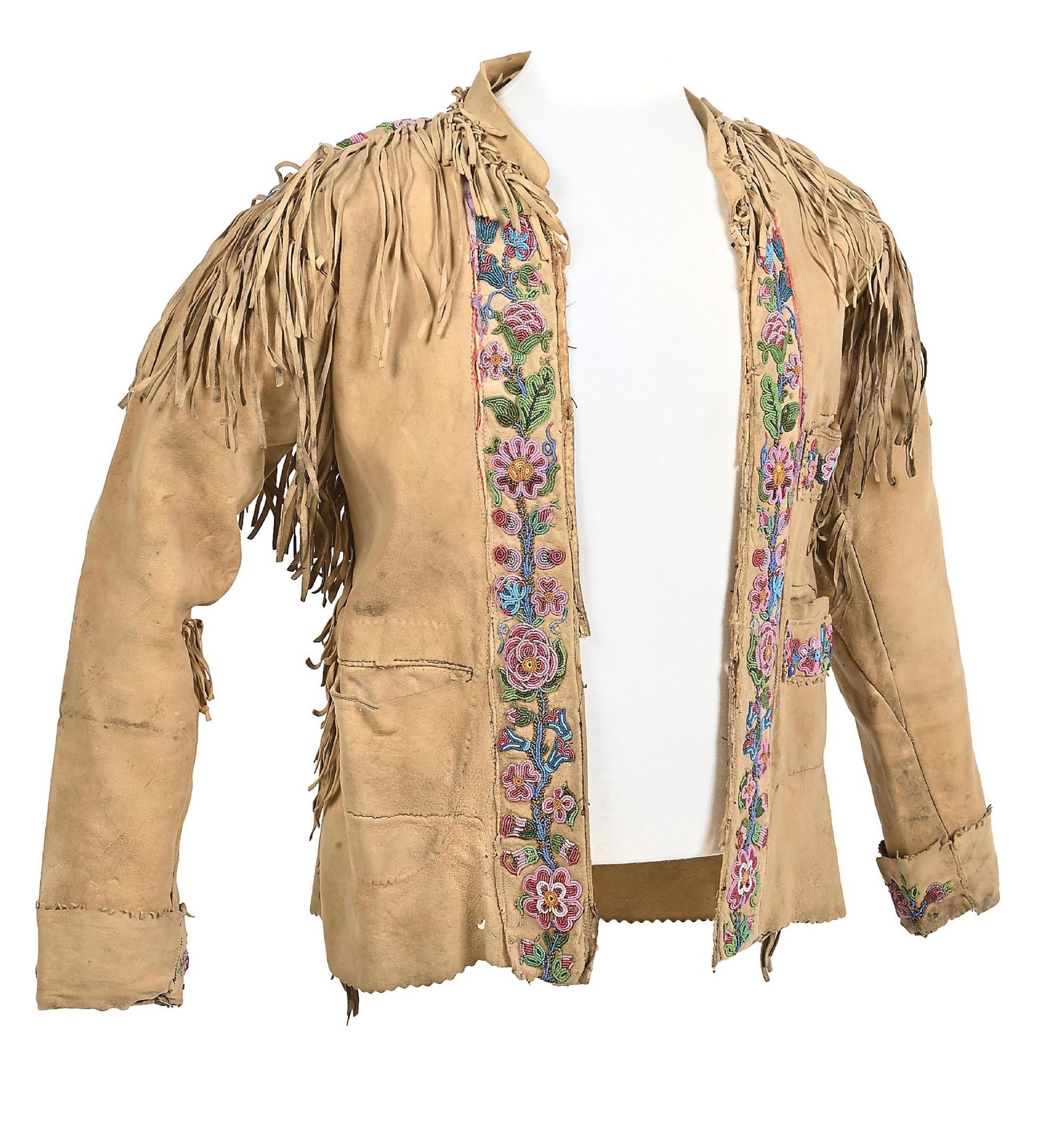 OJIBWA BEADED COAT: A beaded and fringed Great Lakes coat, early style with heavy beaded flowers front and back and long fringe. Most likely caribou hide. Overall very good with some small wear and holes present. 28" x