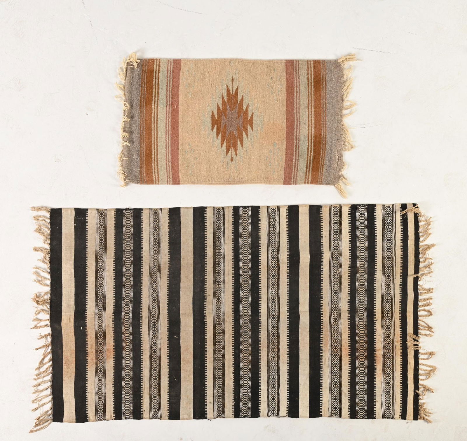 LOT OF 2: SOUTHWESTERN-STYLE WEAVINGS: (A) Zapotec Weaving. Damage to both ends. 19" x 34". (B) Major staining. 33" x 57". Dimensions: Largest: 58" x 33".