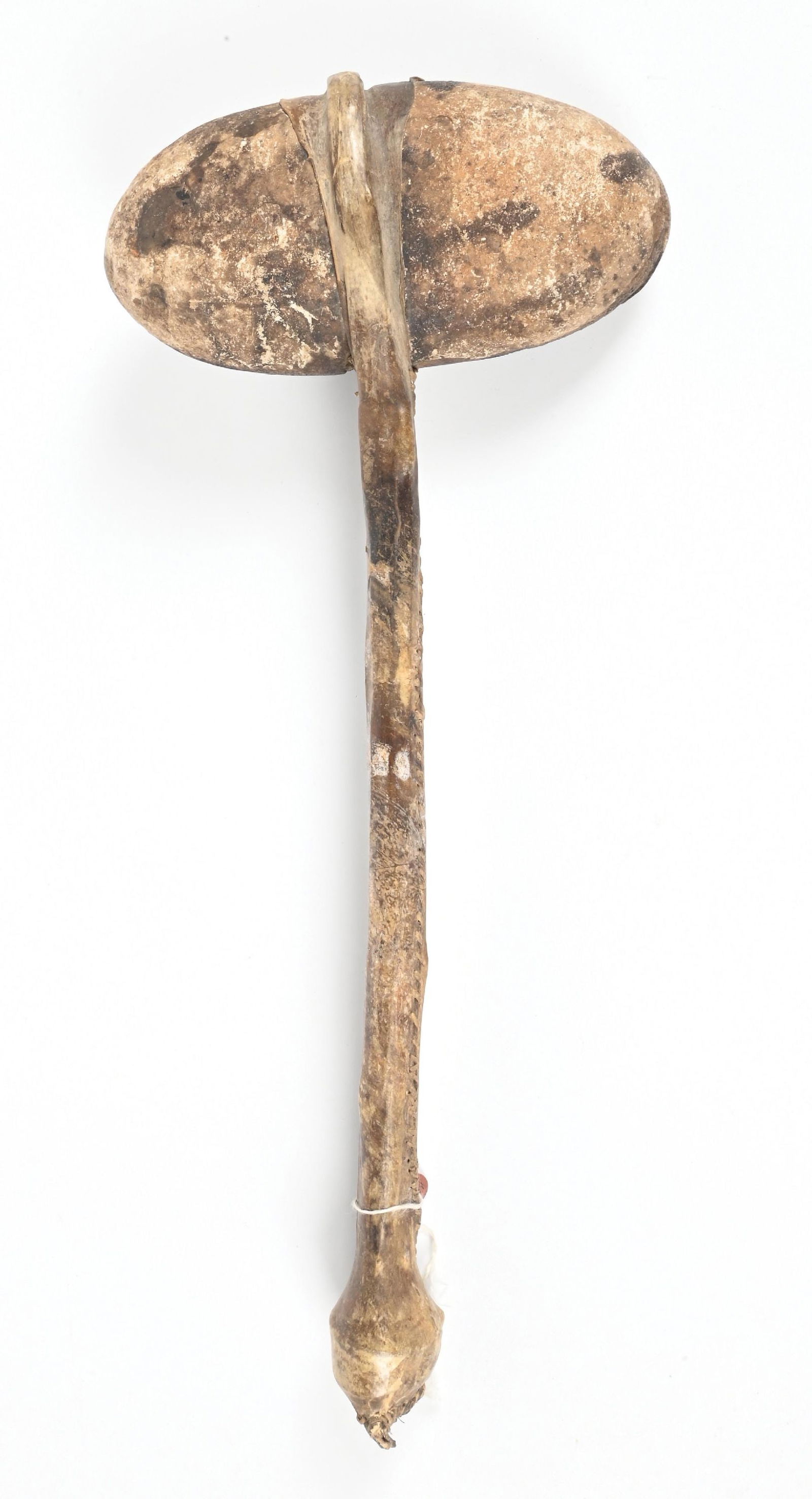 PLAINS STONE CLUB: Contemporary replica. Rawhide-wrapped handle. Dimensions: 8" x 20".