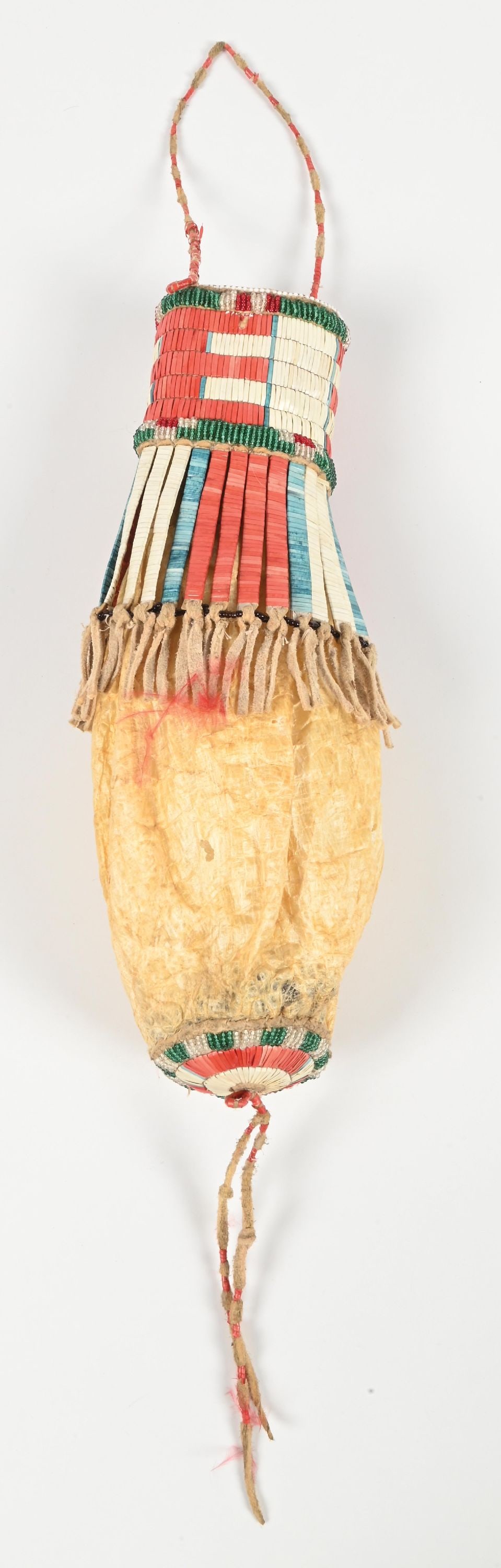 PLAINS BLADDER BAG: Circa mid 20th century. With quillwork and beadwork. Dimensions: 5" x 12" x 4".