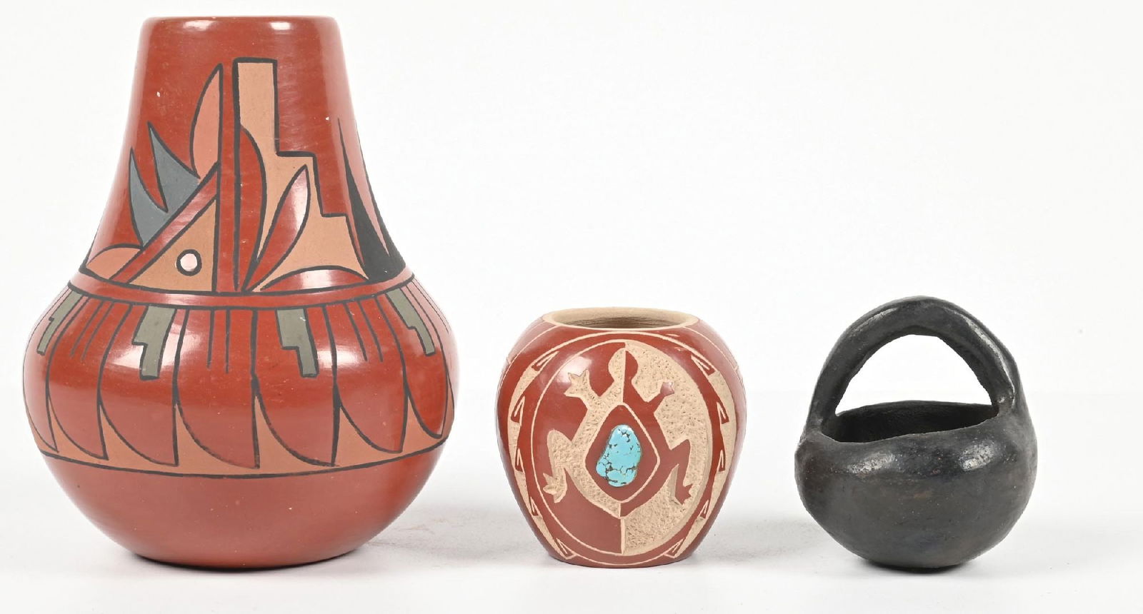 LOT OF 2: SOUTHWEST POTTERY ITEMS: (A) Santa Clara olla, signed "F" and "G" "Naranjo". (B) Santa Clara black pot with handle. Provenance: Estate of N. Harman. Dimensions: Largest: 2" Dia. x 5 - 3/4".