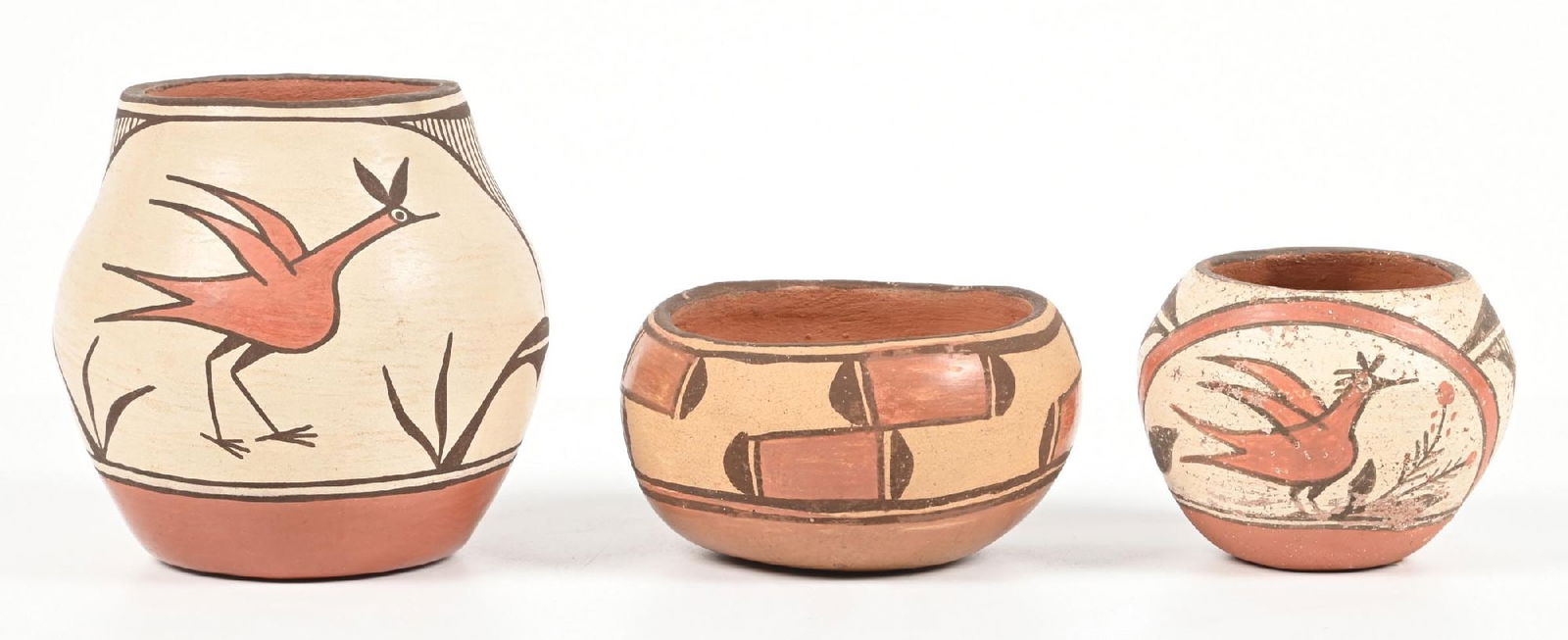 LOT OF 3: ZIA (TS’ÍIY’AM’É) MINIATURES: (A) Signed "Candelario Gachupin". (B) Signed "Joyce Shije". (C) Unsigned. Has some pitting. Provenance: Estate of N. Harman. Dimensions: Largest: 2 - 1/2" Dia. x 4 - 1/4".