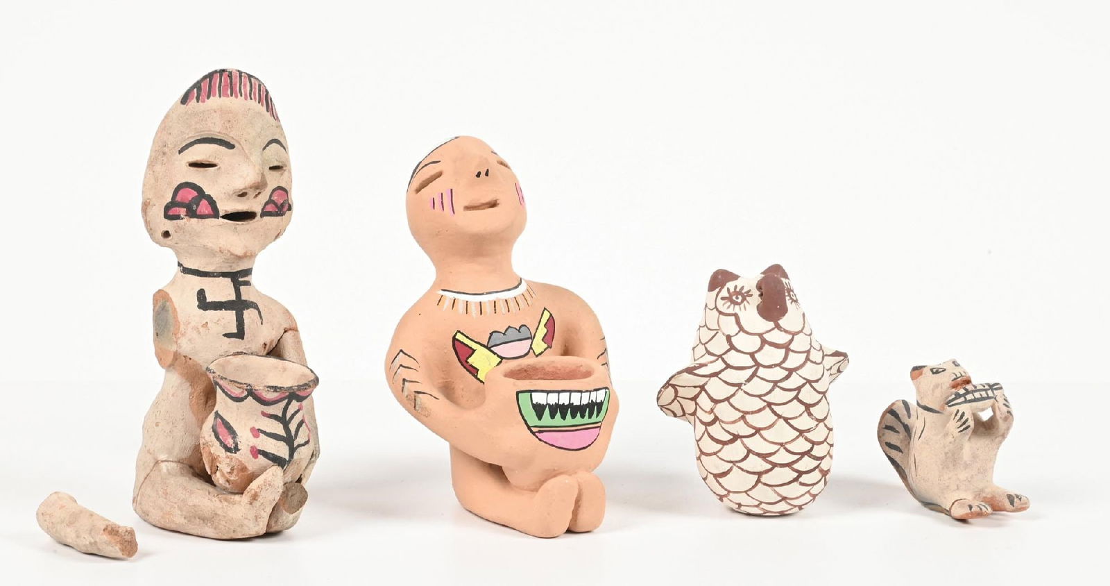 LOT OF 4: NATIVE AMERICAN POTTERY ITEMS: (A) Circa early 20th century Tesuque Rain God. Broken arms and legs. (B) Contemporary Tesuque Rain God. (C) Zuni Pottery Owl, signed "FL". (D) Cochiti Pueblo Squirrel. Provenance of: Estate of N.