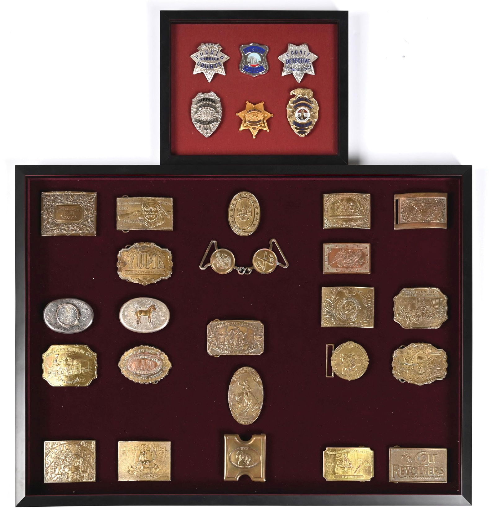COLLECTION OF 2: FRAMED BADGE SET & FRAMED BELT BUCKLE SET: Lot of commemorative and fantasy belt buckles and law enforcement badges. Dimensions: Largest: 31 - 1/2" x 23 - 1/4".