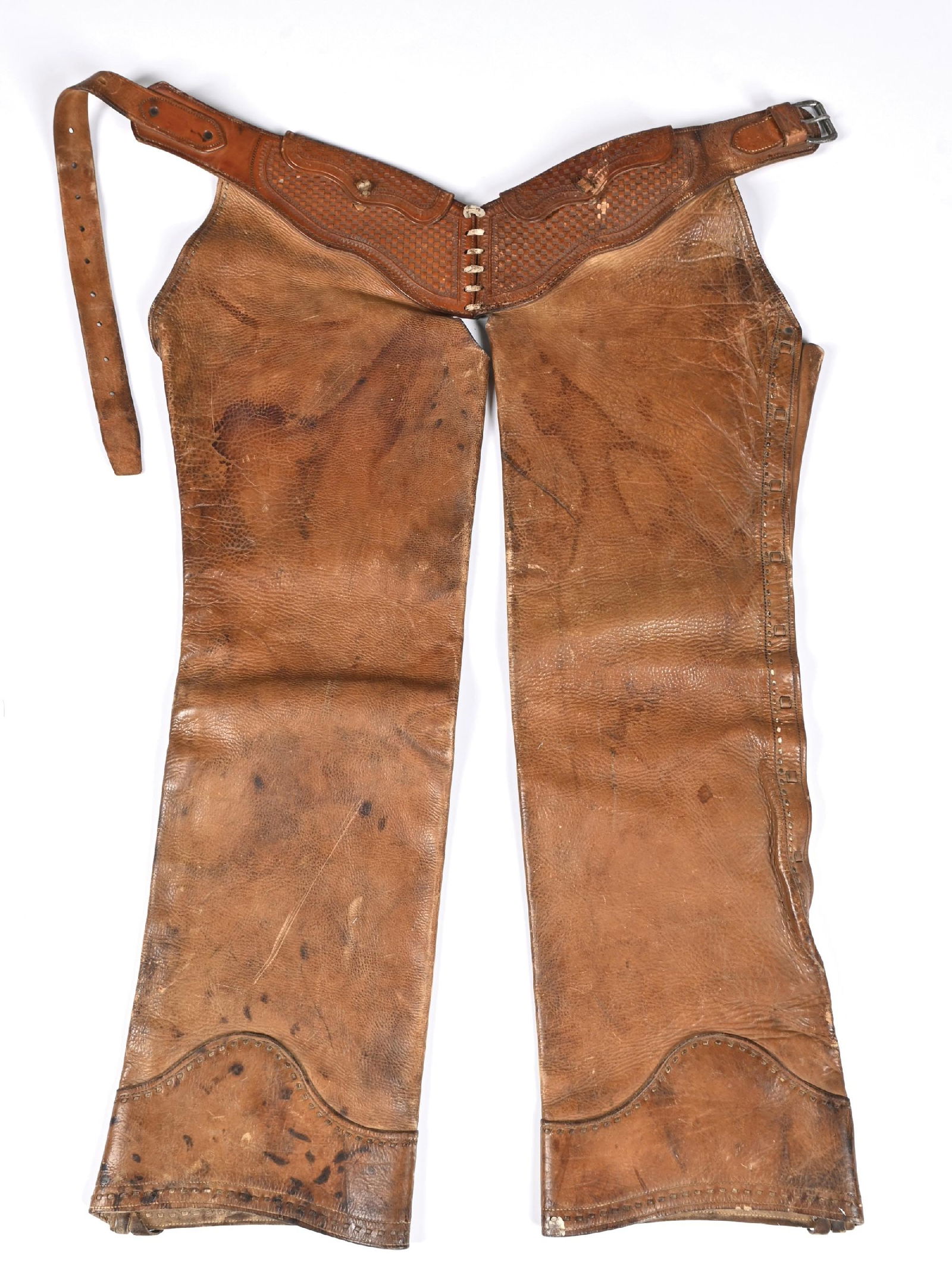 WESTERN SHOTGUN CHAPS: Antique shotgun chaps, most likely bunkhouse made. Leather is supple. Dimensions: 39 - 1/2".