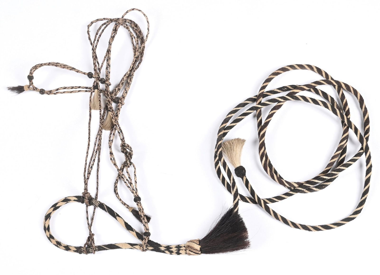 HITCHED HORSEHAIR BOSAL WITH HANGER: Nicely made antique hitched horsehair bosal with matching horsehair hanger and get down rope.