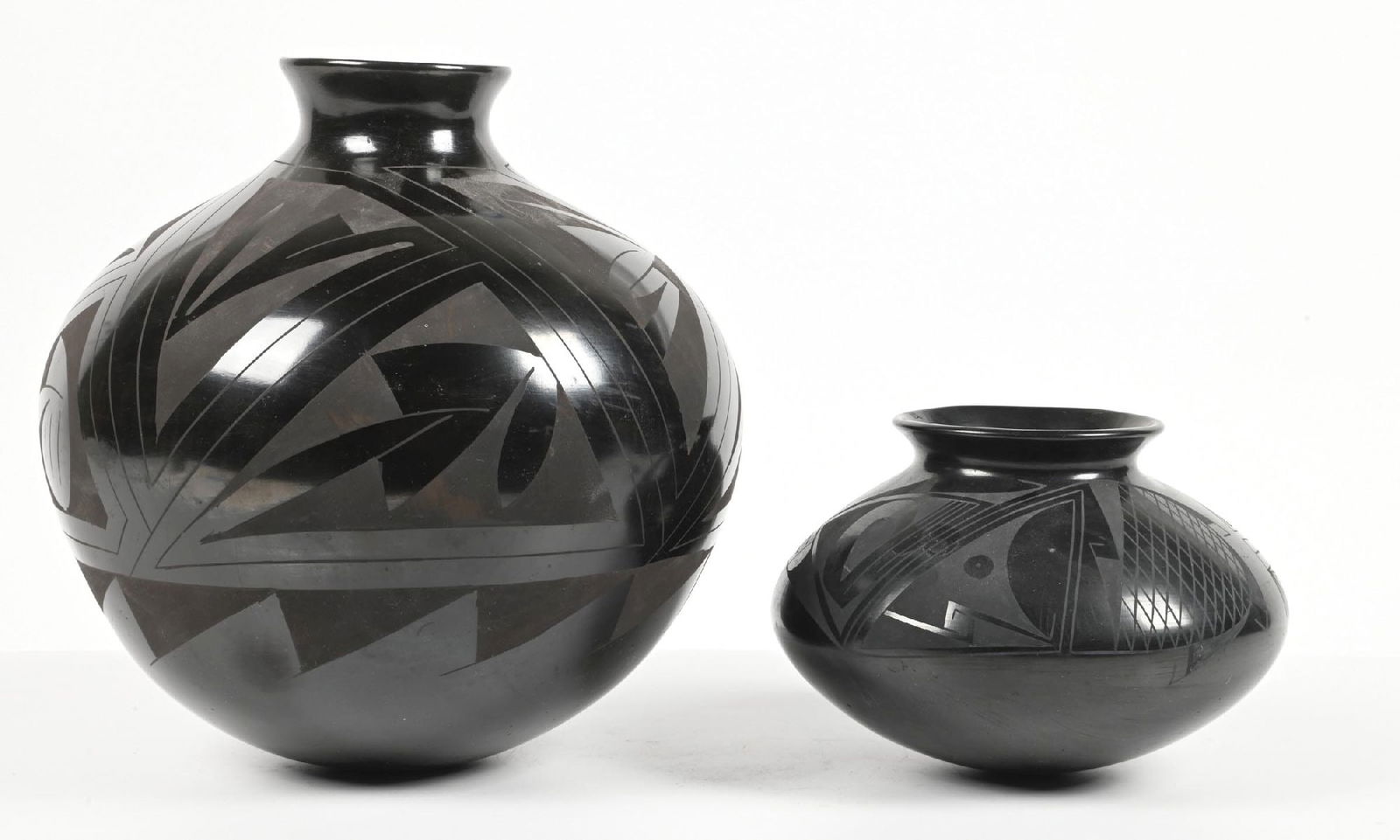 LOT OF 2: CASAS GRANDES (MATA ORTIZ) OLLAS: (A) Signed by Tomas Ozuma, 12 dia. x 12 1/2" t. (B) By Oscar G. Quezada, 9" dia. x 6" t. Dimensions: Largest: 12 Dia. x 12 1/2" T.