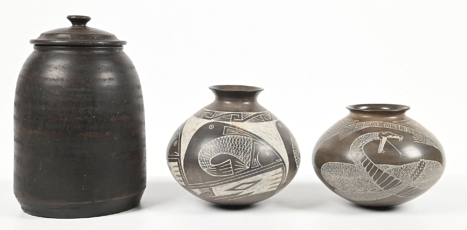 LOT OF 3: CASAS GRANDES (MATA ORTIZ) OLLAS & A POTTERY JAR W/ LID: The two ollas signed "Caby". (A) 8" dia. x 13" t. (B) 9" dia. x 8" t. (C) 9" dia. x 6-1/2" t. Dimensions: Largest: 8" Dia. x 13" T.