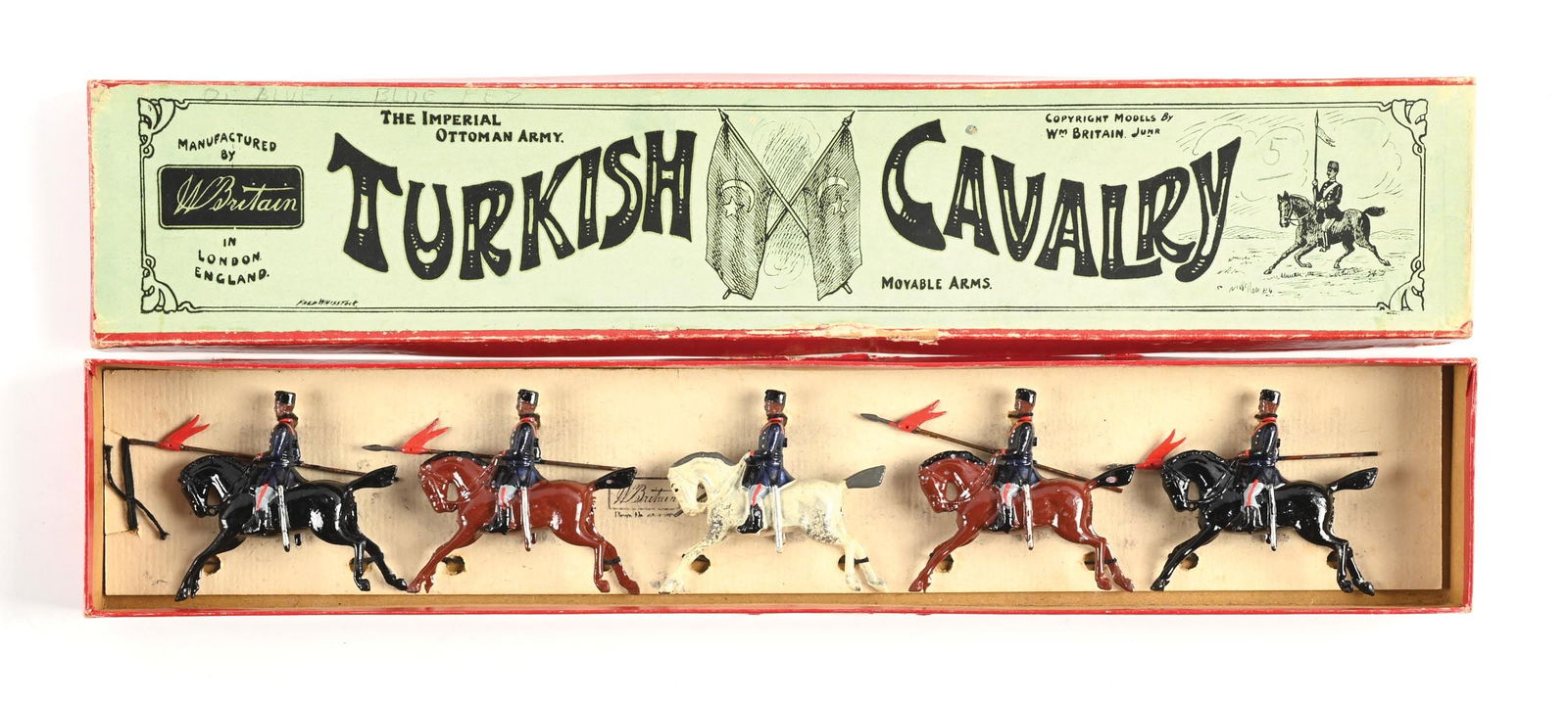 W. BRITAIN TURKISH CAVALRY NO. 71 IN BOX: With officer, lances at the carry. First version. Re-tied, original tie card, excellent condition, nice box. 5 pieces. Dimensions: Box: 18" x 3 - 3/8" x 1 - 1/4".
