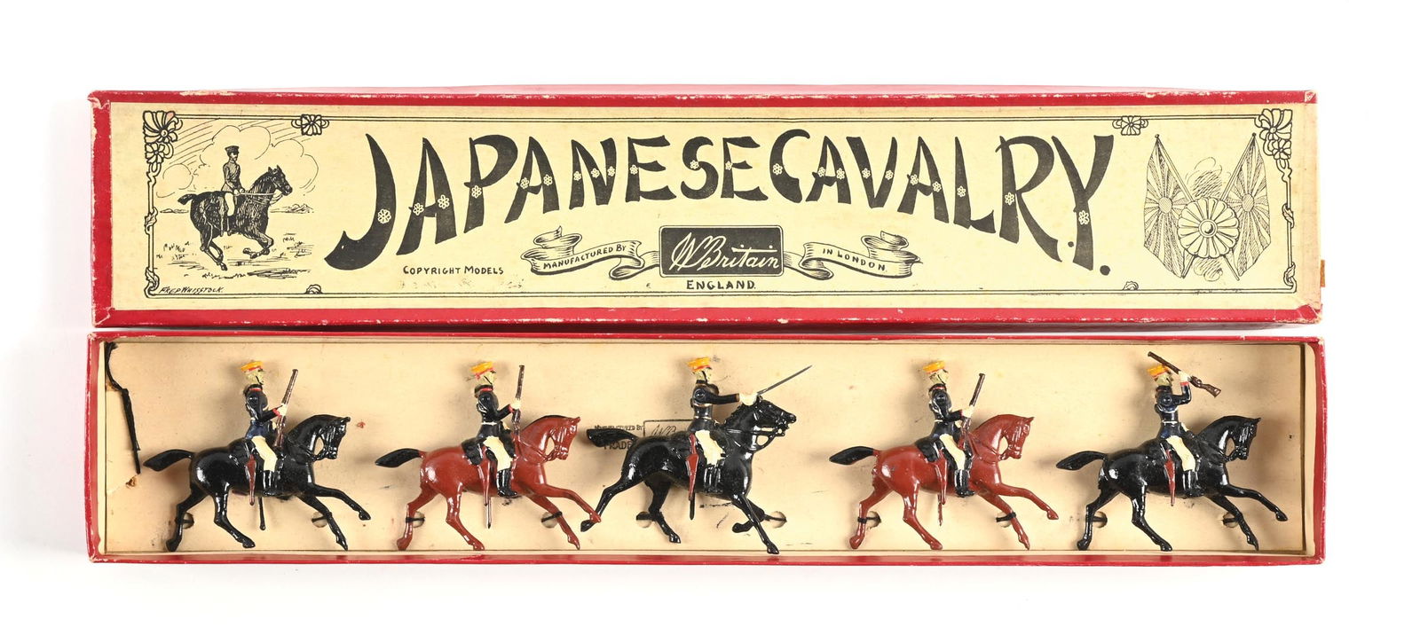 W. BRITAIN THE JAPANESE CAVALRY NO. 135 IN BOX: With mounted officer, dark blue tunics. Re-tied in box. Excellent condition. 5 pieces. Dimensions: Box: 18 - 1/4" x 3 - 1/2" x 1 - 1/4".