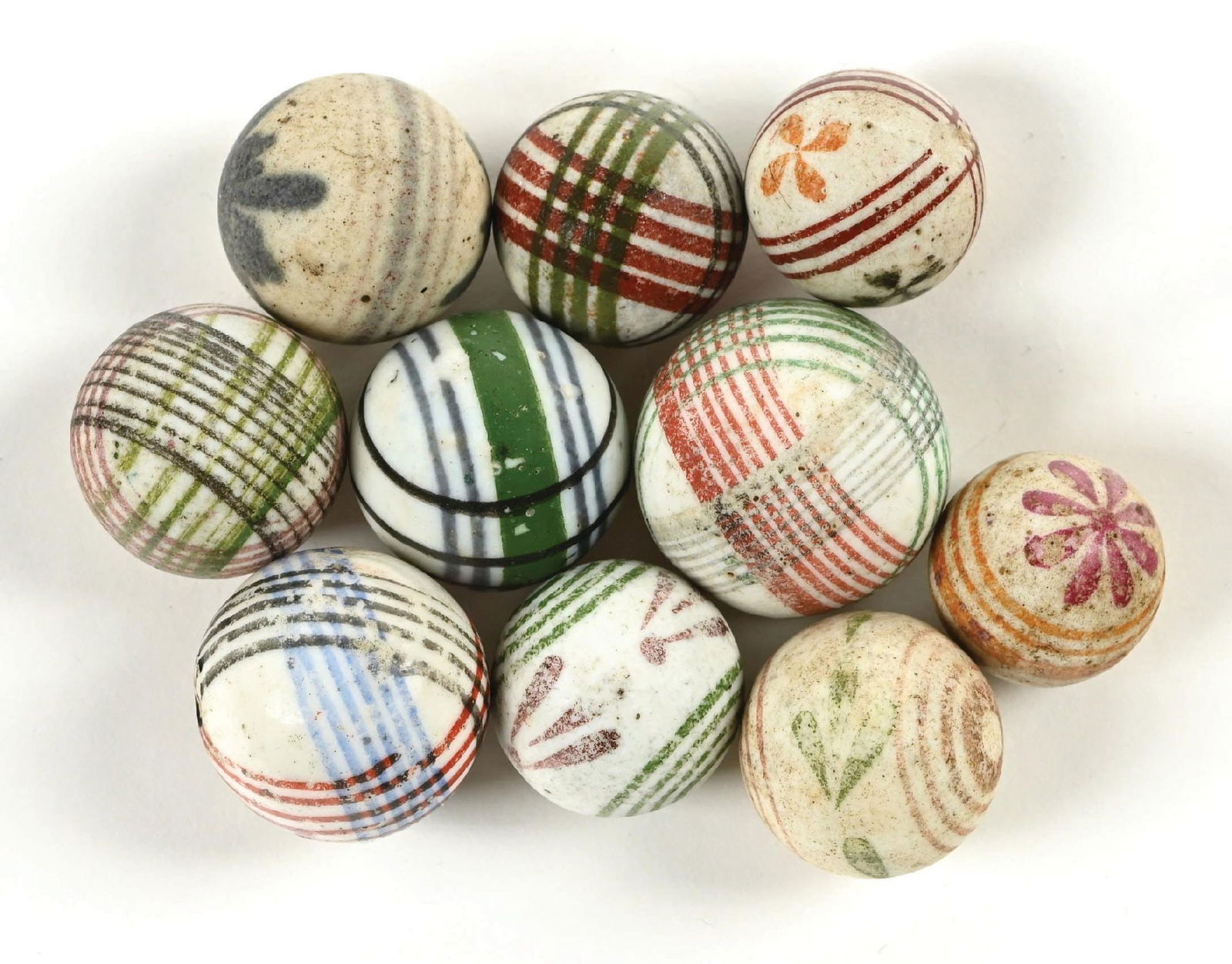 LOT OF 10: GLAZED AND UNGLAZED MARBLES: Nice lot of china marbles. Includes some checkered and floral designs. All are in 8.5+ condition. Condition: Dimensions:
