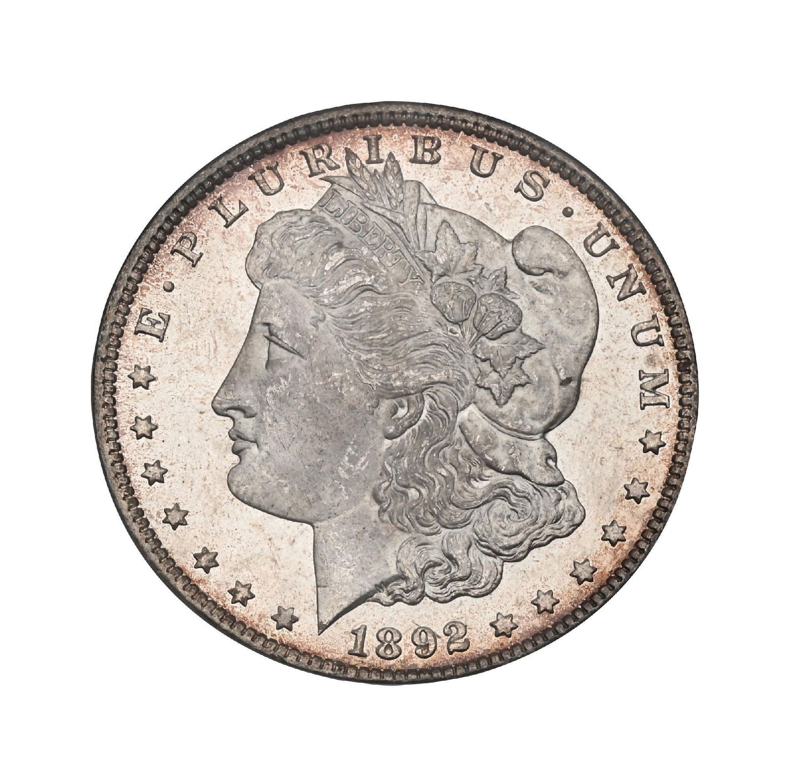 1892-CC $1 MS65 PCGS. CAC.: A standout Gem 1892-CC Morgan Dollar, this example offers exceptional visual appeal and the kind of surface quality that places it firmly in the upper tier of the grade. The fields are smooth, clean,