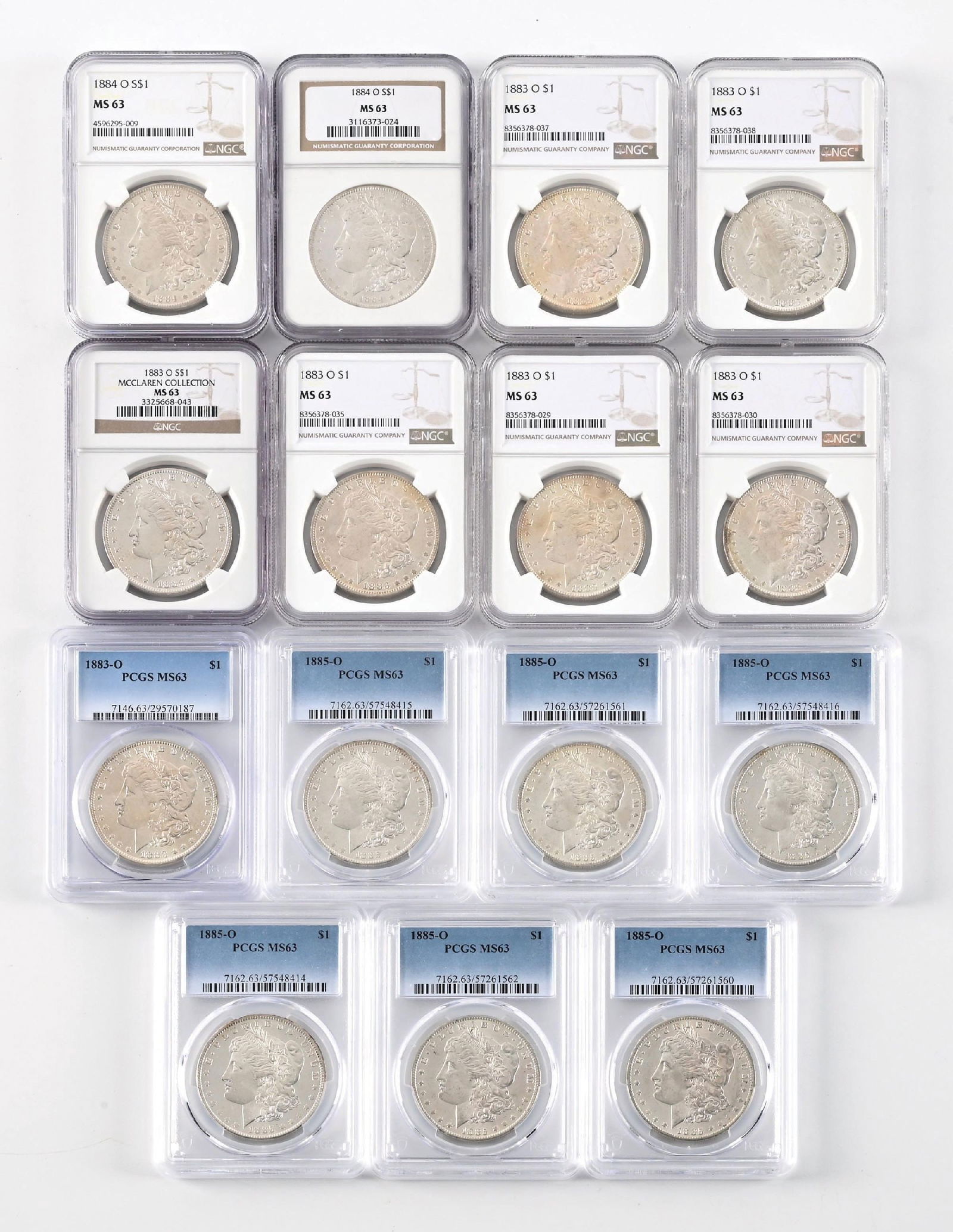 LOT OF 15: 1883-O $1, 1884-O $1 & 1885-O $1 PCGS MS63 PCGS: Include 7 1883-O, 2 1884-O and 6 1885-O all in MS63 PCGS.