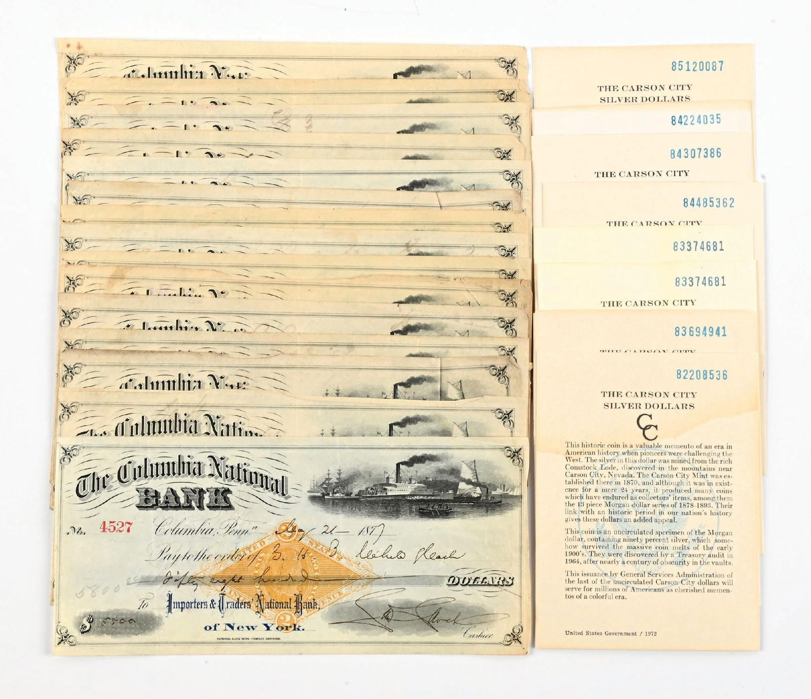 16 PC BANK DRAFT - PUNCH CANCELED 1870S & 10 CARSON CITY SILVER DOLLAR GSA COA: An engaging group of cancelled checks from the Columbia National Bank of Columbia, Pennsylvania, each showcasing the charm of early 20th-century financial ephemera. The checks feature beautiful hand-s