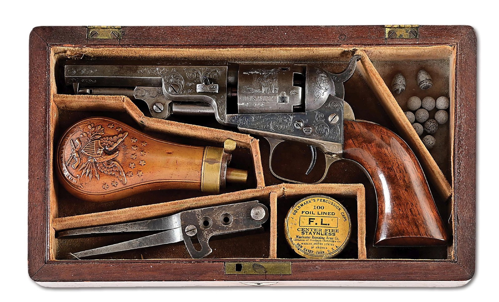 (A) FACTORY ENGRAVED AND CASED LONDON COLT 1849 POCKET PERCUSION REVOLVER.: Dates to first year London from 1853. The head Colt factory engraver at that time was Gustave Young. The finish on this gun was the standard blue and case color featuring the octagon barrel and varnis