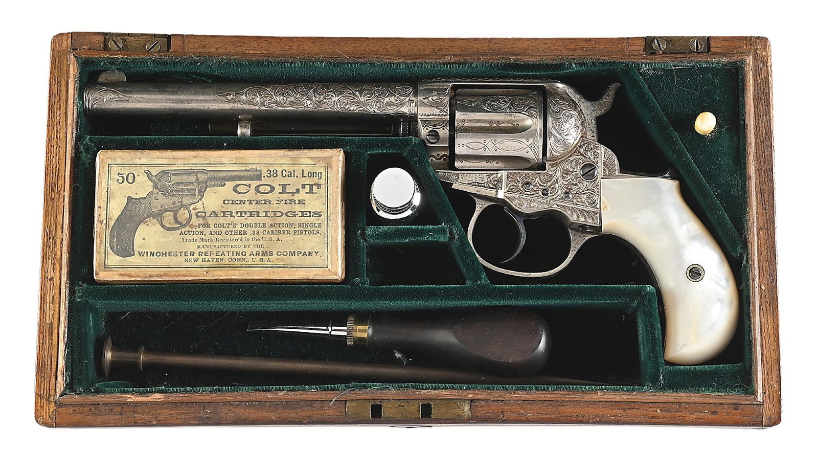 (A) ENGRAVED AND CASED COLT MODEL 1877 LIGHTNING .38 DOUBLE ACTION REVOLVER.: Manufactured 1887 with 6" Barrel in .38 Colt. Nickel finished. Engraved in the New York style of the period with scroll and vine and chiseled borders. Mounted with well fitting Mother Of Pearl grips.