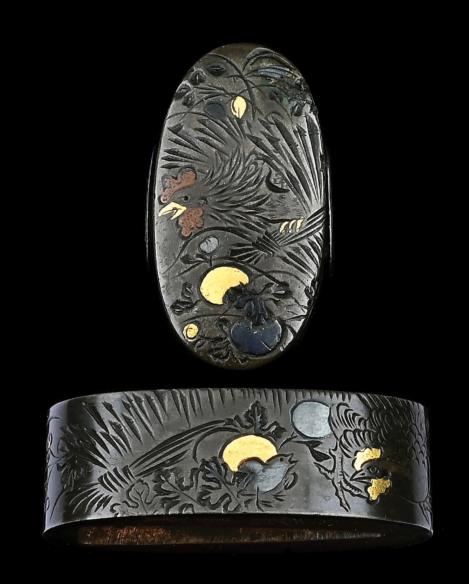 FUCHI KASHIRA WITH KATAKIRIBORI AND HIRAZOGAN DESIGNS OF BIRDS.: Measures approximately 2.1cm by 3.7cm and 1.2cm tall at the fuchi, kashira is 1.8cm from shitadome to shitadome, 3.3cm long, and .5cm tall. Both pieces are made of shibuichi, a Japanese silver and cop