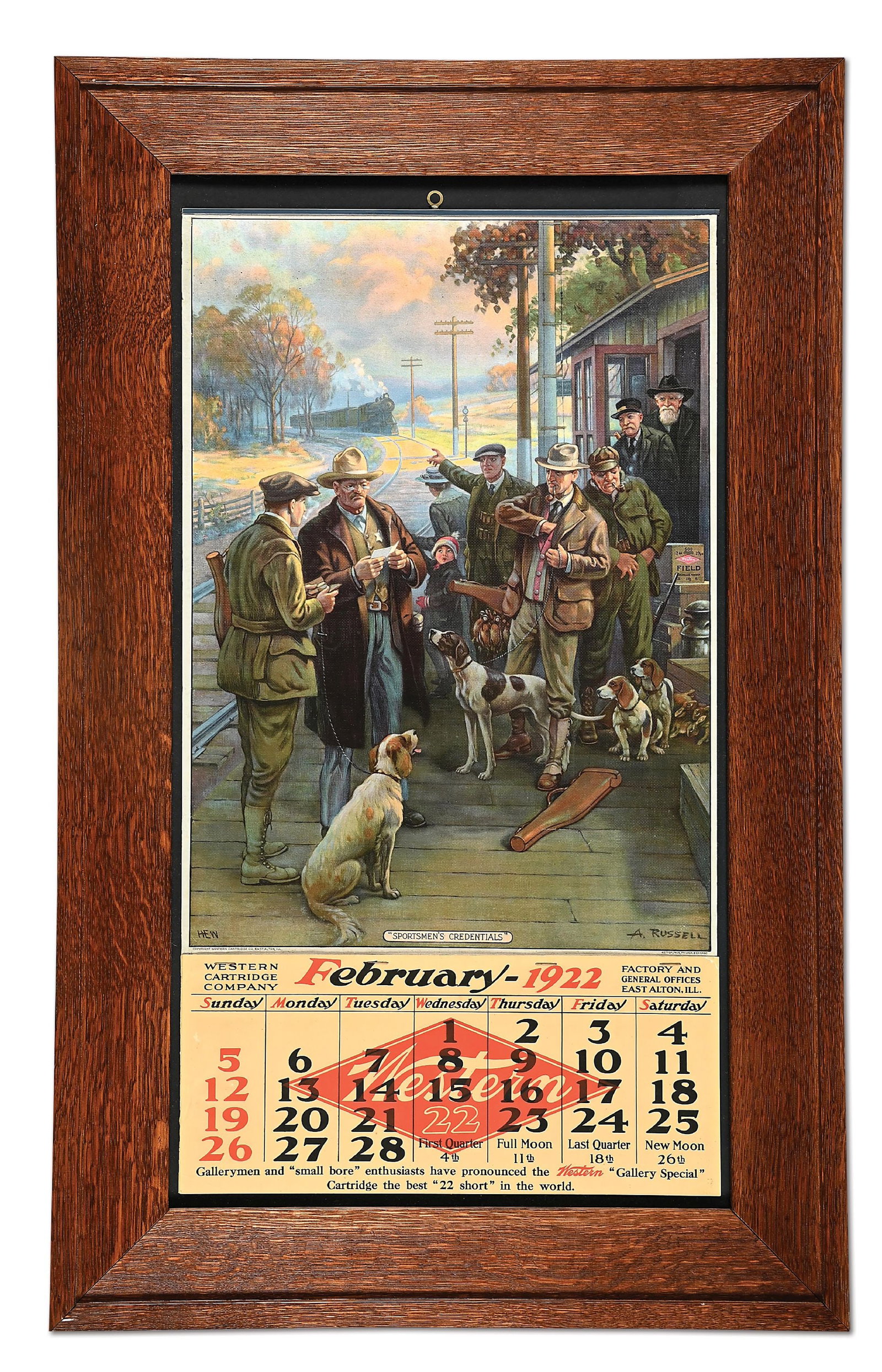 1922 WESTERN AMMUNITION LITOGRAPHED ADVERTISING CALENDAR - FRAMED: This full color lithograph has a single February 1922 sheet attached. Featuring a wonderful image of hunters, dogs and a sheriff checking credentials at a train depot. Poster still retains the top met