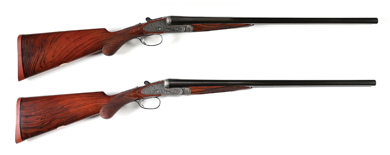 (C) NICELY REFURBISHED PAIR OF E.J. CHURCHILL PINLESS "PREMIER" XXV SIDELOCK EJECTOR SINGLE TRIGGER: (1924) The "Premiere" sidelock was Churchill's highest grade, many were built with pinless sidelocks allowing for an uninterrupted flow of engraving. Screws that hold bridle and all pivots except the