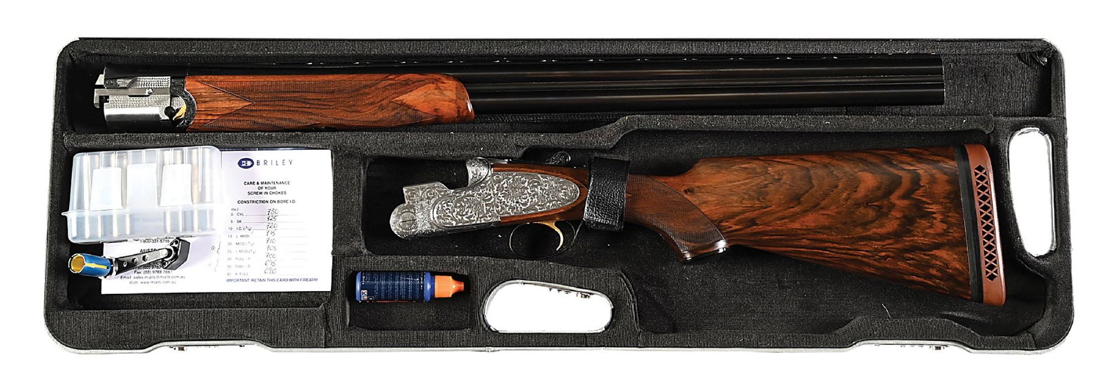 (C) ZOLI ENGRAVED BERETTA S05 OVER UNDER 12 GAUGE SPORTING SHOTGUN.: Mono-bloc barrels are fitted with raised, matted, ventilated rib with Beretta name and address along with "Made in Italy" on top right side of mono-bloc, with importers name and address (Garcia Sporti