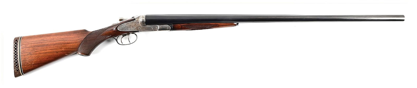 (C) SCARCE L.C. SMITH IDEAL GRADE 10 BORE SIDE BY SIDE SHOTGUN: The serial number dates this gun to approximately 1915. This was the largest gauge Ideal produced. The I grade is stamped on water table as well as barrel flats. It features the standard oak leaf engr