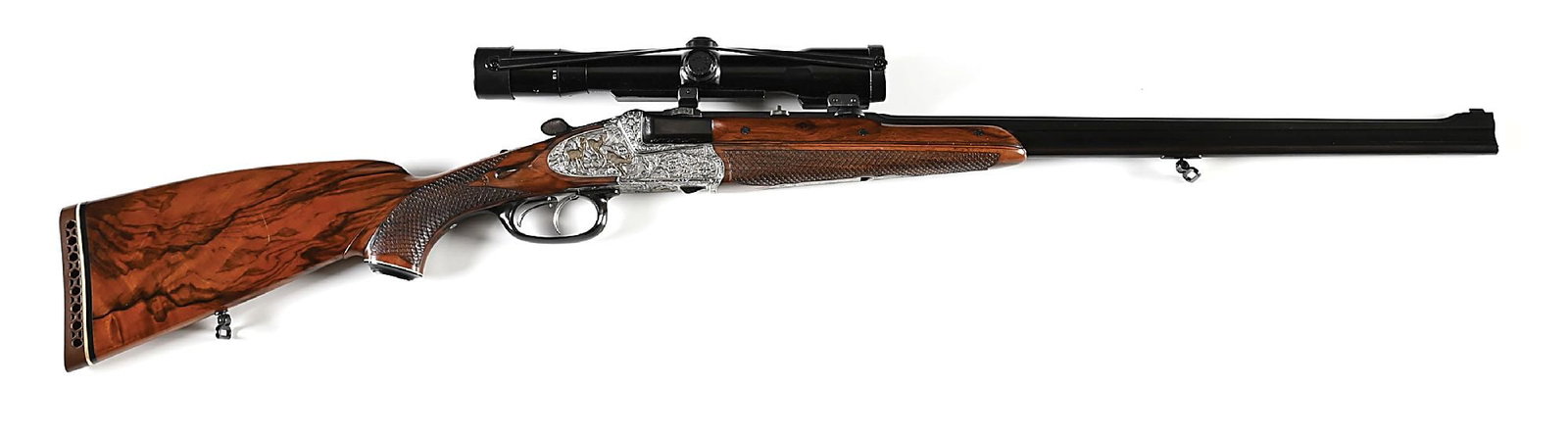 (M) FRANZ SODIA OVER UNDER DOUBLE RIFLE IN .222 REMINGTON AND 7X65R.: Crafted in Austria in 1976. Blued Bohler Rasant superposed barrels, the upper barrel of slender slab sided from, the lower rounded. Upper barrel has had its chambered opened to .222 Remington, the bot